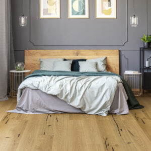 Posters on grey wall with molding above wooden bed in modern bed Oak Accent